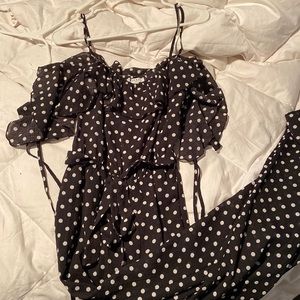 Black and white polka dot pantsuit with off the shoulder sleeves. Size medium